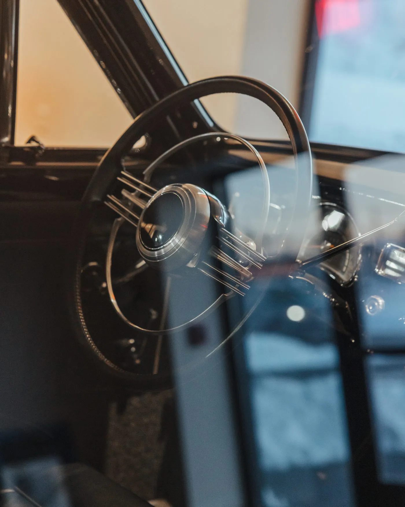 The steering wheel of a vintage collector automobile