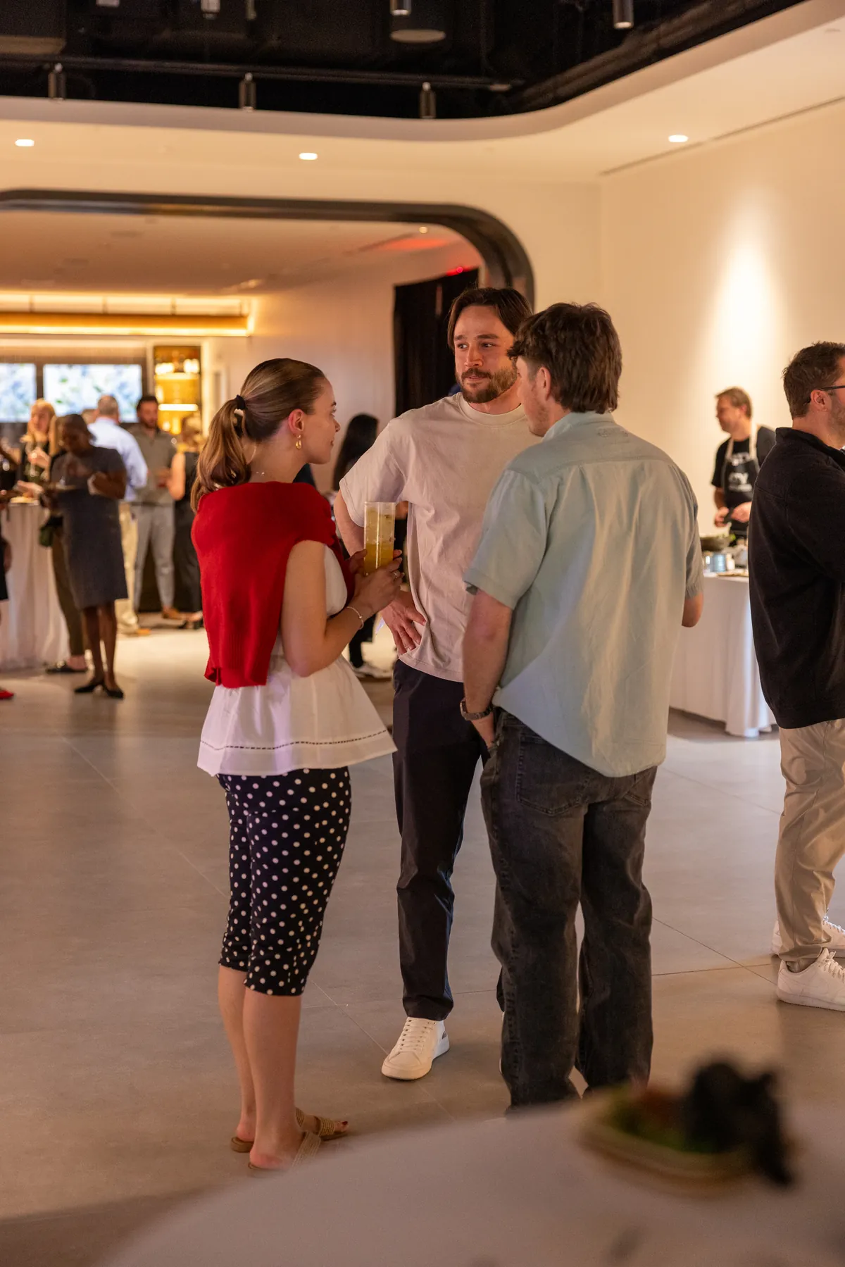 Guests mingling at a Driven by Taste event