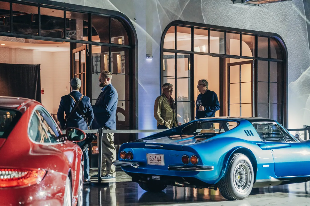 Guests among the collection through the gallery arches