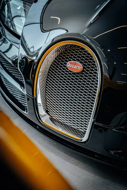 A polished radiator grille in low light