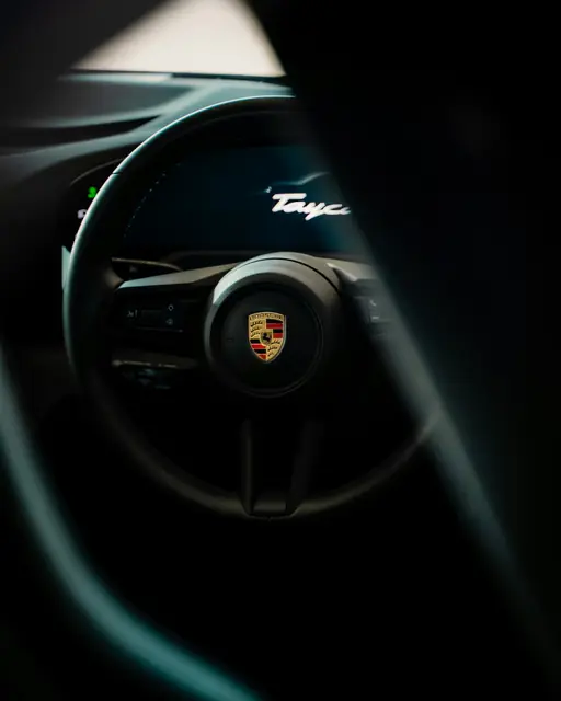 A dark steering wheel close up